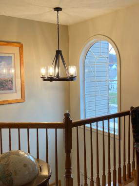A hanging chandelier installed as a foyer light in a Glenshaw home.