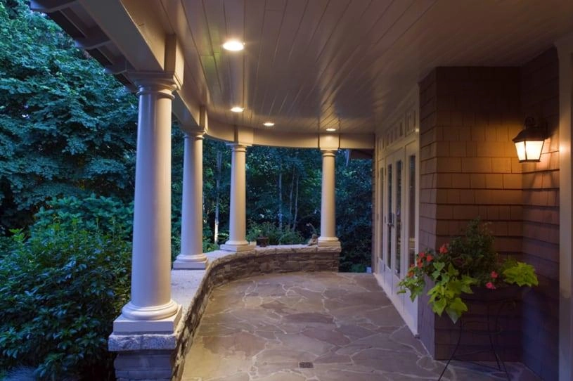 Large front porch with white pillars.
