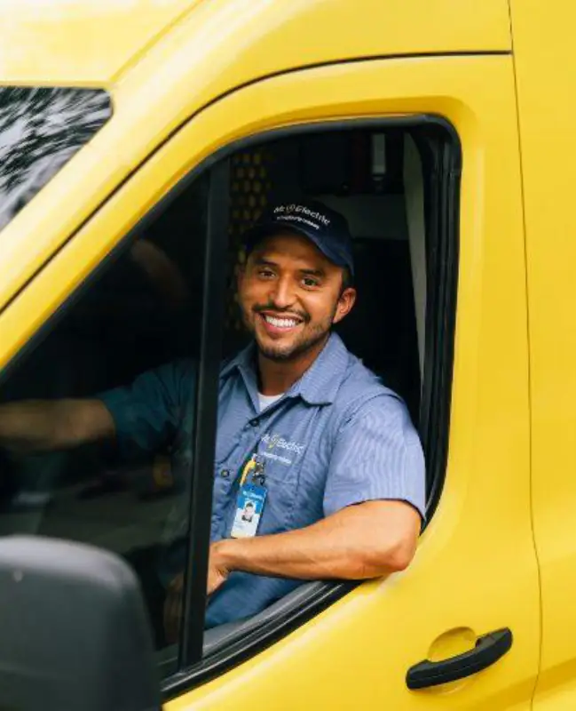 Mr. Electric electrician sitting in truck.