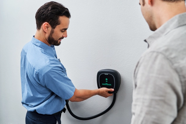 Mr. Electric electrician installing an EV charger.