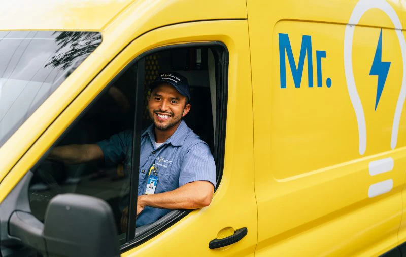 Mr. Electric electrician driving to an office to perform a commercial generator installation