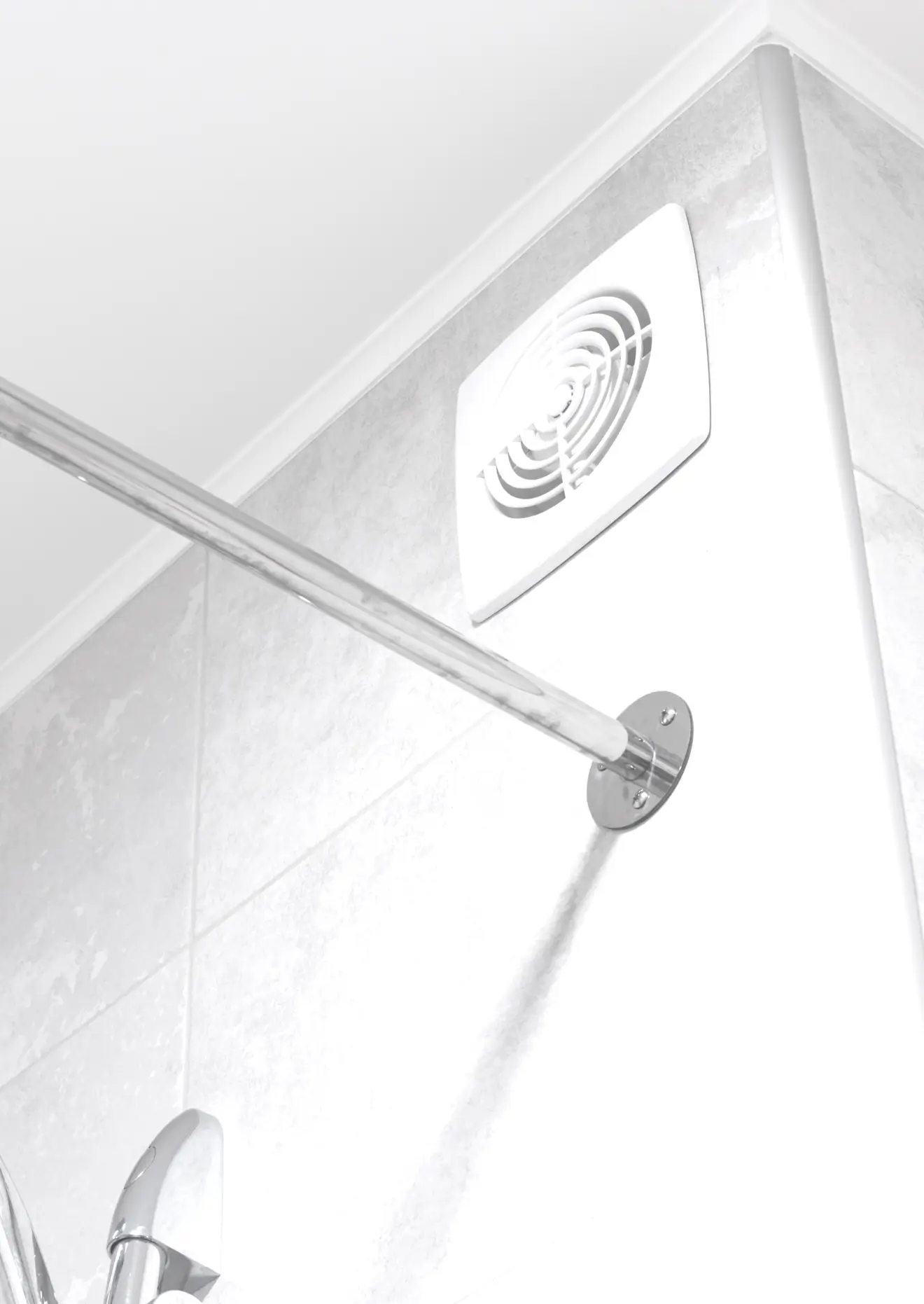 Modern bathroom with two white ventilation fans installed on a light grey tiled wall, beside a chrome showerhead and curtain rod.