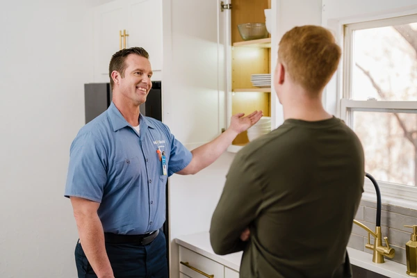 Mr. Electric electrician consulting with the homeowner about cabinet lighting.