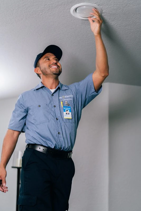Mr. Electric electrician installing retrofit recessed lighting
