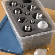 Clear box with various lightbulbs in it.