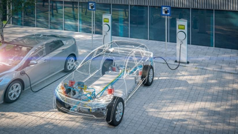 3d rendered X-ray image of generic electric car with battery visible charging at public charging station in city parking lot