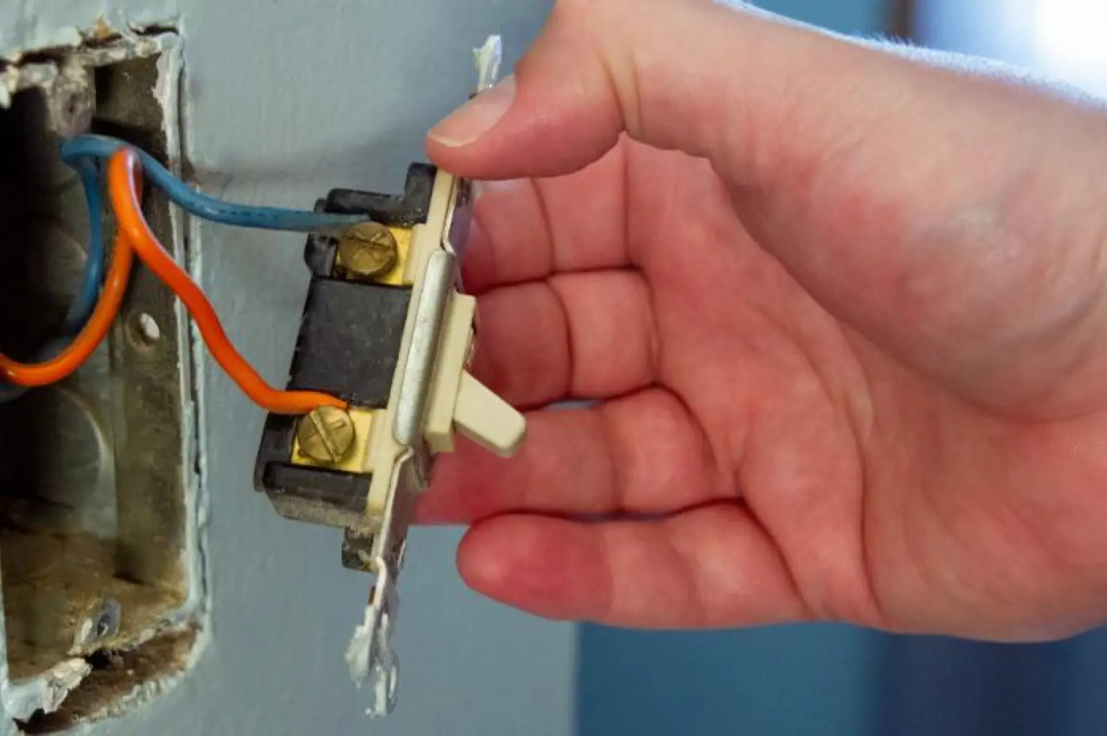 A light switch being inspected